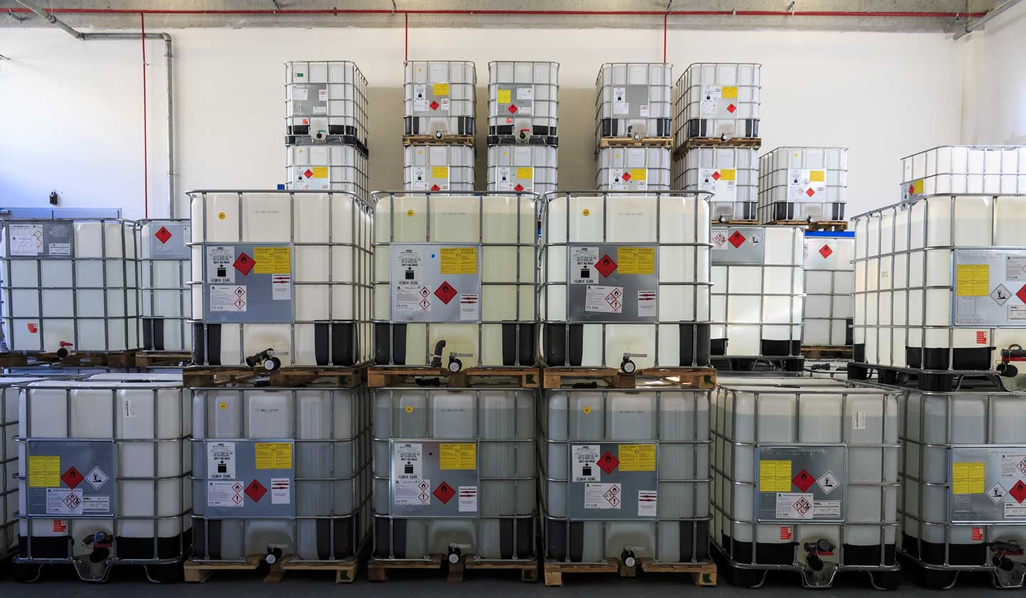 IBC Containers with highly flammable chemical liquids in warehouse